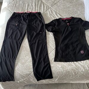 Koi lite dobby scrubs. Both sized medium.